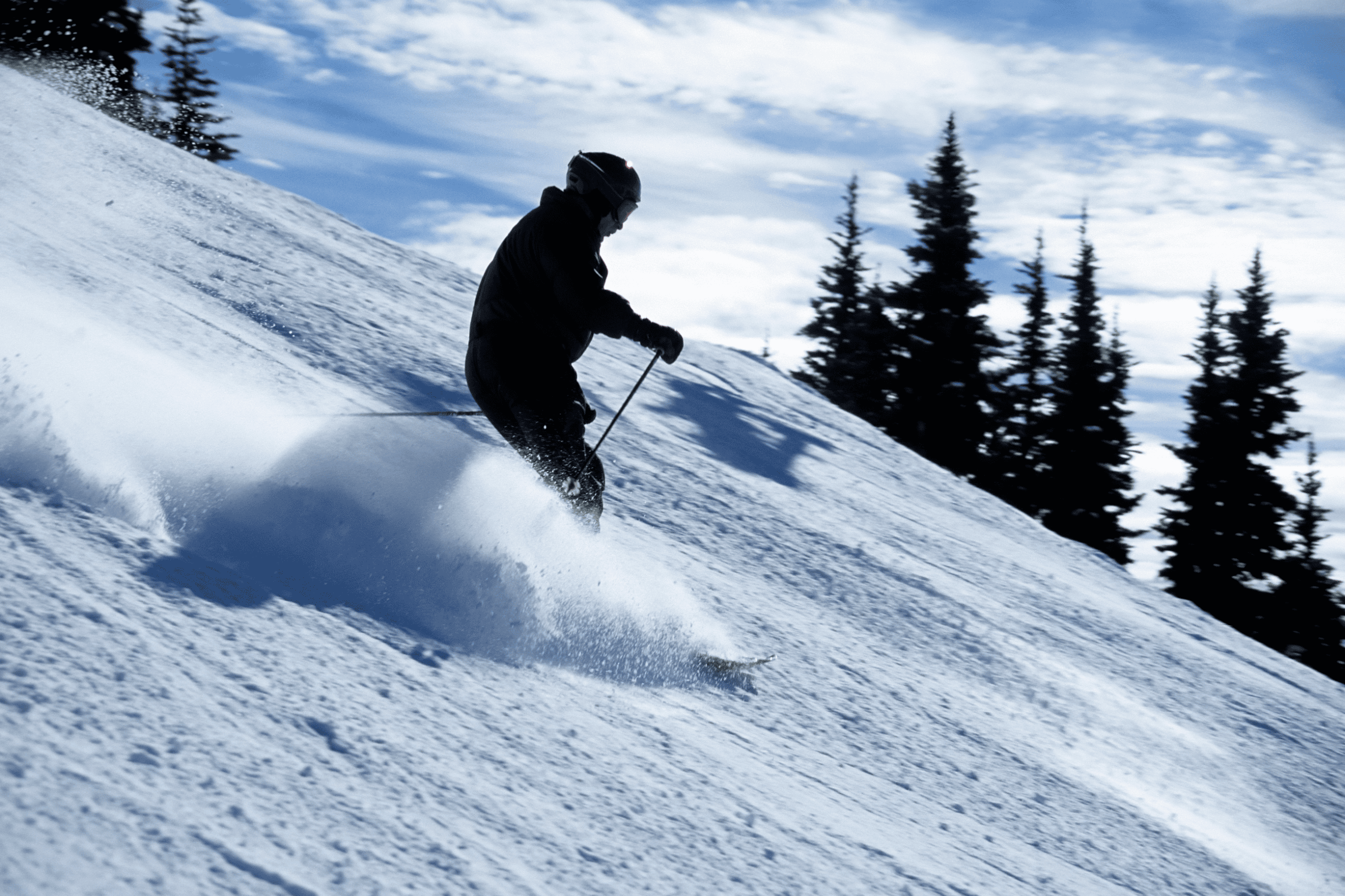 person skiing down the slope
