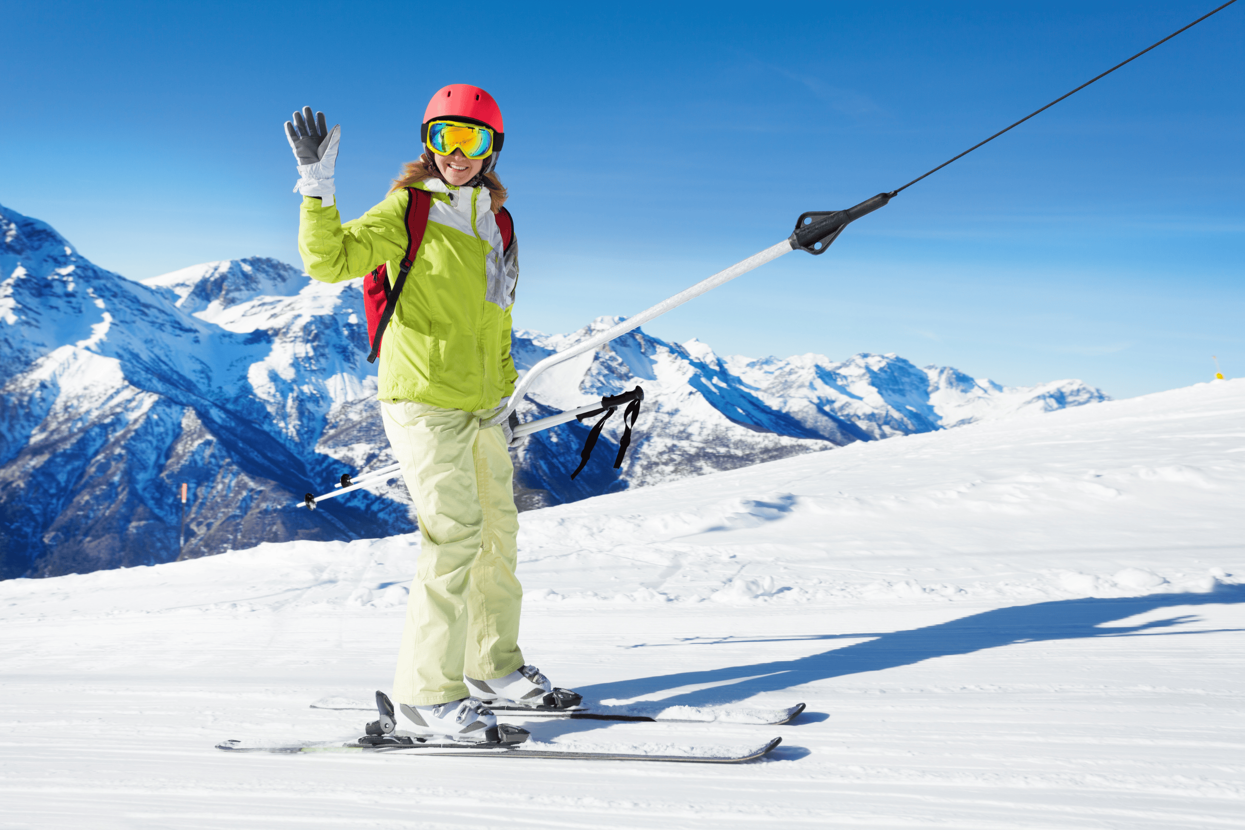 very happy skier on her skis